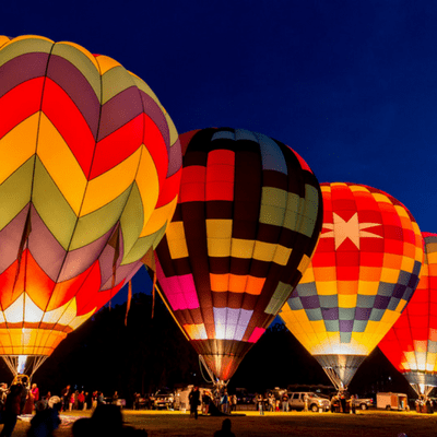 Hot air balloons lit from within are a beautiful sight to behold.